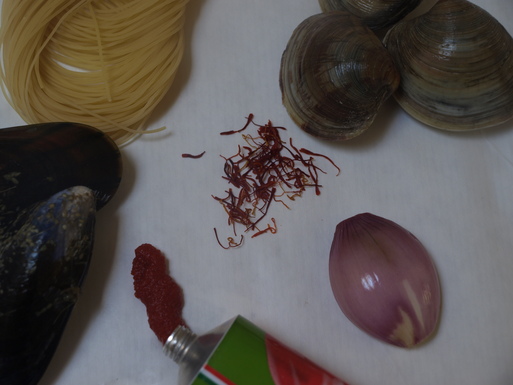 Capellini with mussels & clams in rich saffron broth