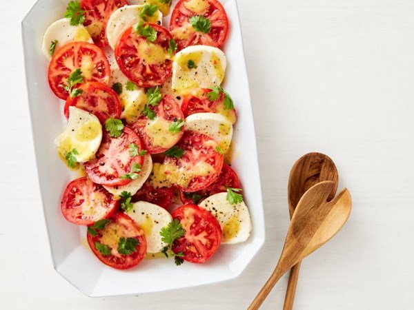 Caprese salad with roasted mango dressing 
