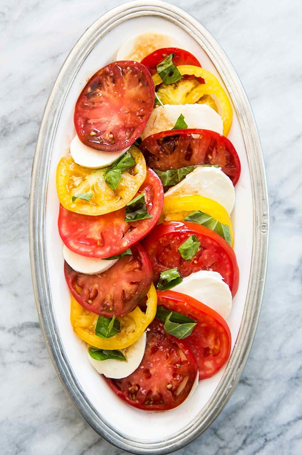 Caprese salad with tomatoes, basil, and mozzarella 