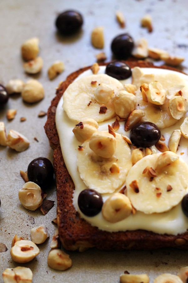 Caramel macchiato ricotta toast with hazelnuts, bananas, and chocolate-covered espresso beans