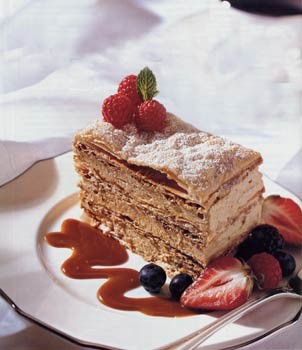 Caramel mousse Napoleon with caramel sauce and berries