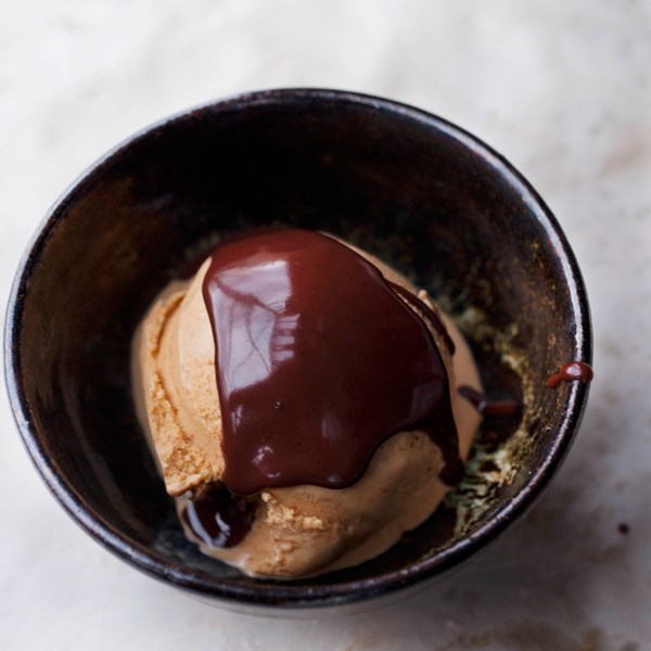 Caramel peanut ice cream with chocolate sauce and peanut brittle