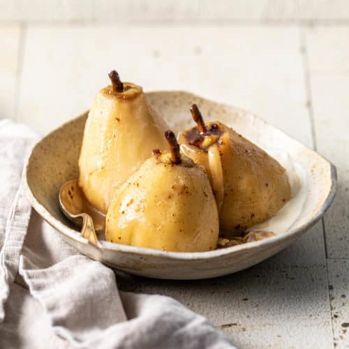 Caramel-poached pears stuffed with Appenzeller and roasted hazelnuts