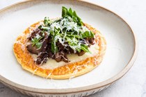 Caramelised onion and Gruyère tarte fine, salad of crispy duck and watercress