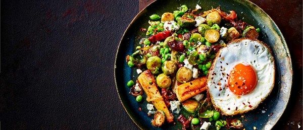 Caramelised onion, sprout and bacon hash with chilli fried eggs
