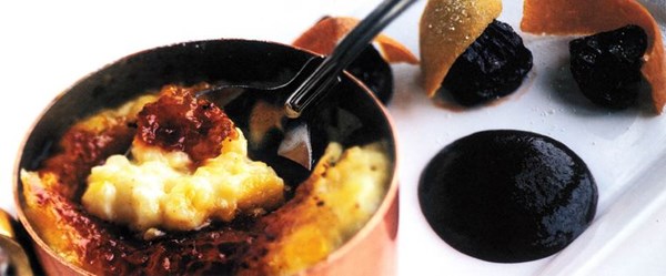 Caramelised rice pudding with Ampleforth apple brandy, mulled boozy prunes, cinnamon-baked cats' tongues