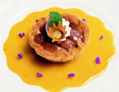Caramelized apple galette in phyllo dough with kumquat sauce