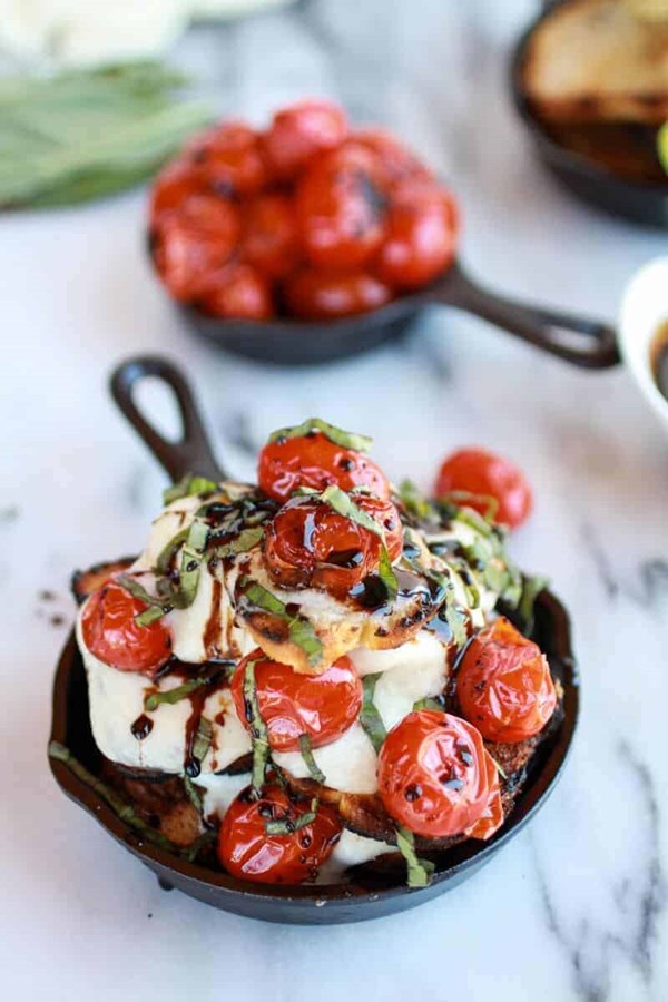 Caramelized blistered tomato grilled toast Caprese nachos with balsamic glaze