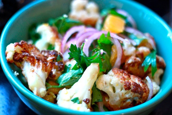 Caramelized cauliflower with oranges, olives and saffroned cous cous