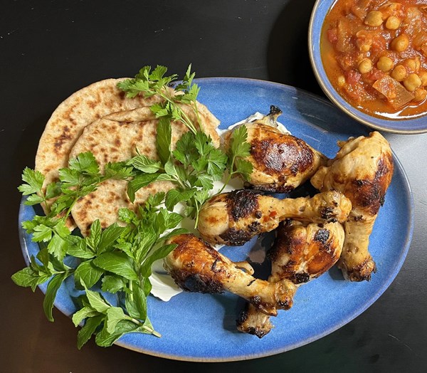 Caramelized harissa drumsticks with simmered chickpeas