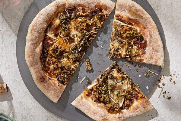Caramelized onion and Fontina pizza with crispy kale