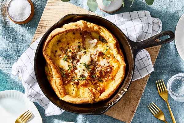 Caramelized onion Dutch baby with melty Gruyère
