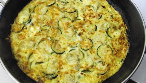 Caramelized onion frittata with artichoke hearts, zucchini, and goat cheese