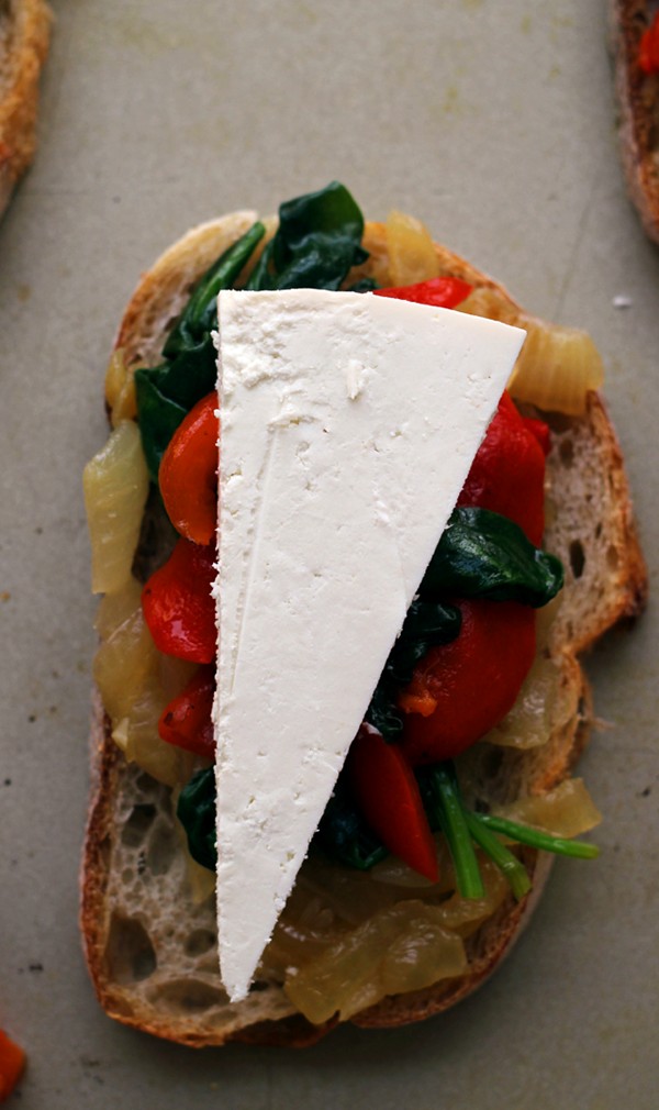 Caramelized onion, spinach, roasted red pepper and ricotta salata crostini