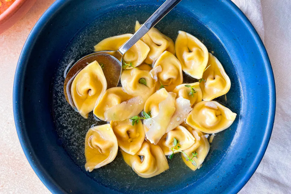 Caramelized onion tortelli in Parmesan broth