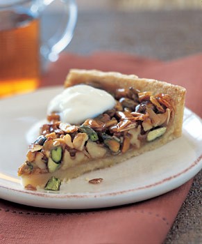Caramelized pistachio, walnut, and almond tart