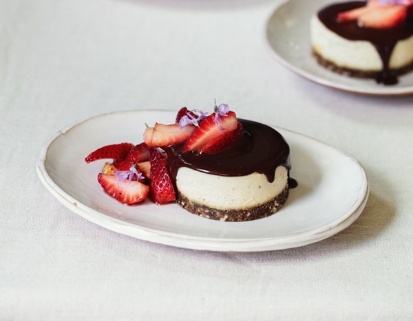 Cardamom cheesecake with bitter chocolate sauce & black pepper strawberries