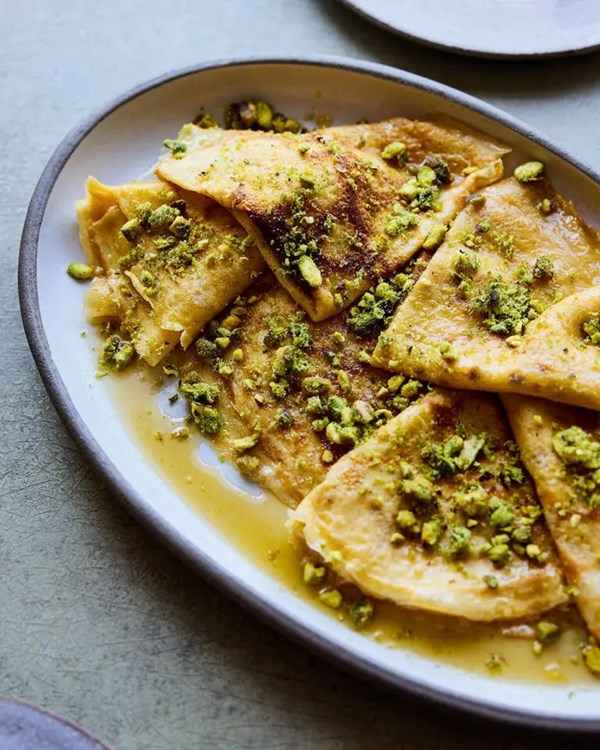 Cardamom pancakes with honey lime syrup