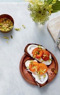 Cardamom-poached apricots with vanilla quark and pistachios on toast