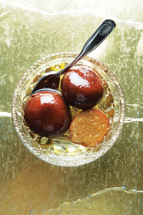 Cardamom syrup-soaked donuts (Gulab jamun)