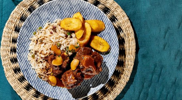 Caribbean delight (stewed oxtails with rice and gandules [peas]) [Leanna Pierre]