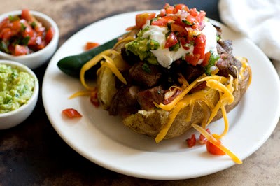 Carne asada stuffed potatoes