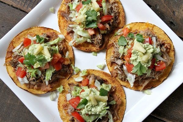 Carnitas tostadas with pineapple guacamole