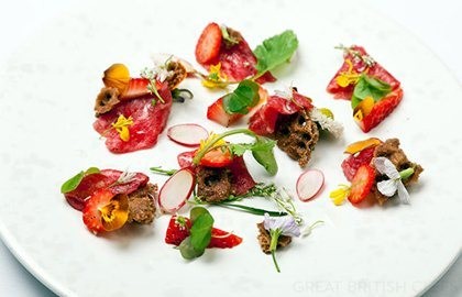 Carpaccio of beef with pickled Sweet Eve strawberries, wild spicy leaves and Ryvita