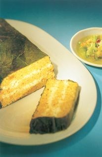 Carrot, almond and feta terrine, in vine leaves, with a green pepper-coriander salsa