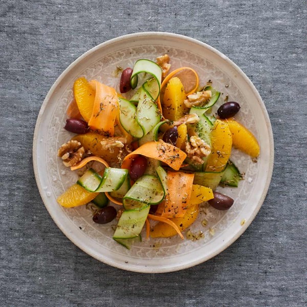 Carrot and cucumber with oranges and olives