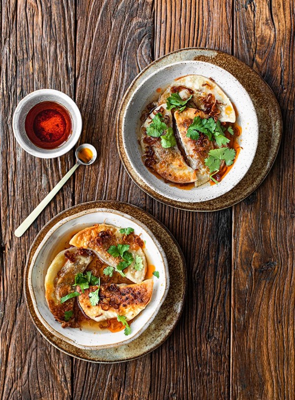 Carrot and tofu dumplings in broth with shallot oil