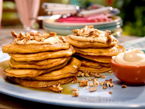 Carrot cake pancakes with maple-cream cheese drizzle