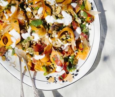 Carrot salad with yogurt, pickled raisins, and pistachios