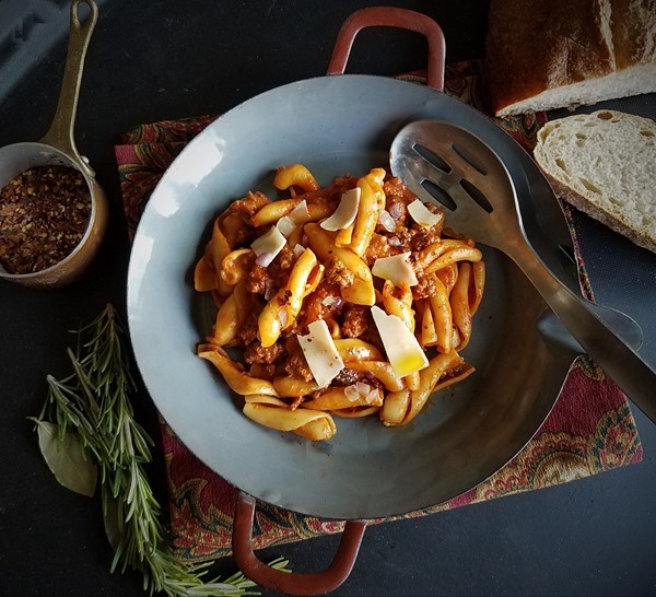Casarecce with spicy chorizo sausage - tomato, chili, rosemary and Parmesan