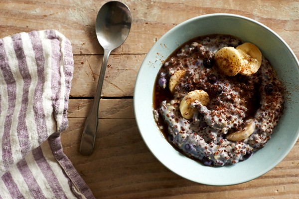 Cashew milk red quinoa porridge with spice, fruit, and maple