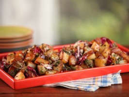 Cast-iron home fries with roasted green chiles and creamy garlic dressing
