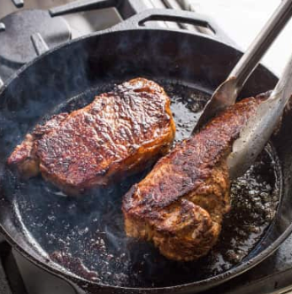 Cast iron steaks with blue cheese-chive butter