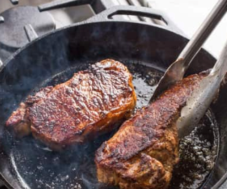 Cast iron steaks with blue cheese-chive butter