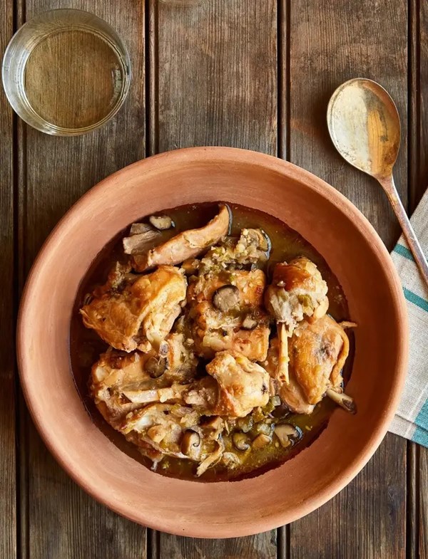 Catalan-style rabbit stew recipe with sherry, mushrooms, and almonds 