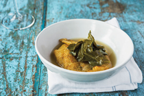 Catfish with pickled greens & chile broth