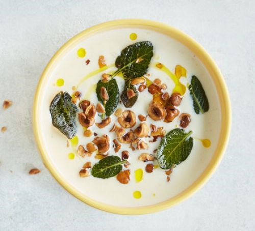 Cauliflower cheese soup with crispy sage and hazelnuts