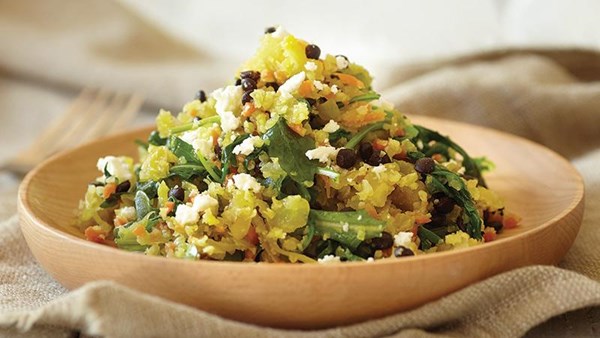 Cauliflower couscous with black lentils and heirloom greens