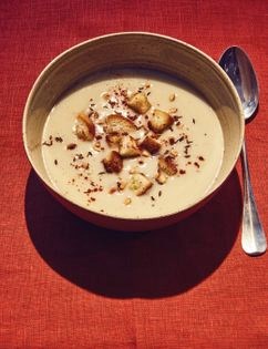 Cauliflower crème with coconut, cumin & pine nuts