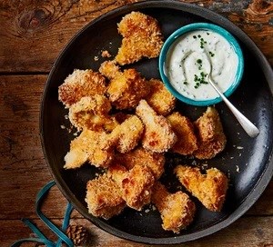 Cauliflower popcorn with soured cream & herb dressing