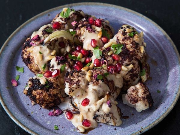 Cauliflower shawarma with pomegranate, tahini, and pine nuts