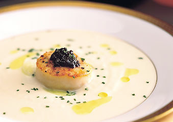Cauliflower soup with seared scallops, lemon oil, and American caviar