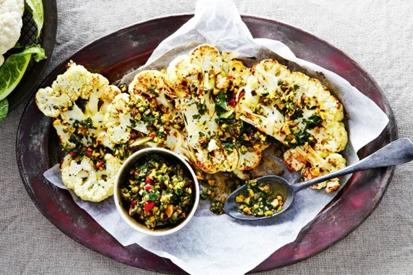 Cauliflower steaks with olive and herb salsa