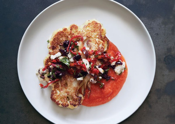 Cauliflower steaks with olive relish and tomato sauce