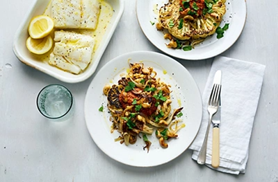 Cauliflower steaks with onion & cashew sauce
