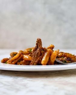 Cavatelli with braised duck ragù and black truffles